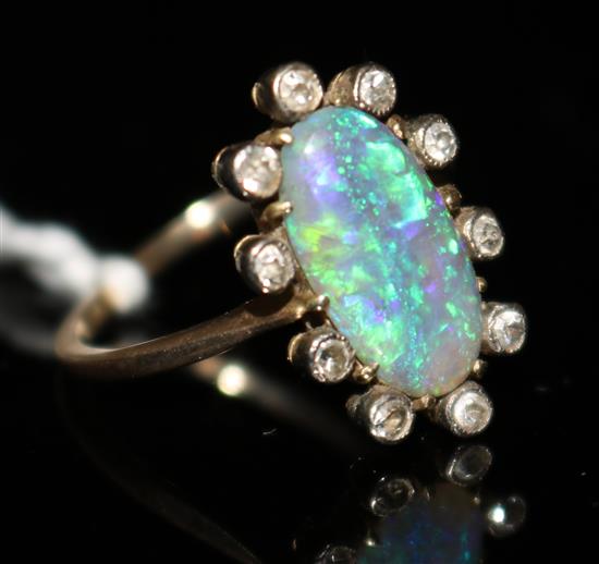 An early 20th century gold, black opal and diamond cluster ring, size O.